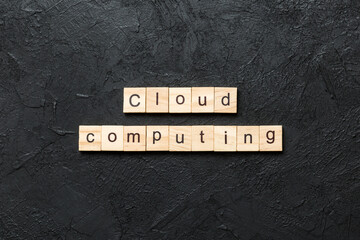 Wall Mural - Cloud computing word written on wood block. Cloud computing text on cement table for your desing, concept