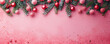 © LeManna - Top view on the pink background with lying decorated fir branches on it. Christmas theme. Banner, card and wallpaper concept.