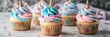 © The 2R Artificiality - Charming unicorn cupcakes topped with pink and blue buttercream frosting, ideal for decorating children's birthday celebrations.