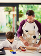 © ThurstanBuyout/peopleimages.com - Dad, boy and teaching with dough for baking in kitchen for role play, fun and child development or growth. Family, parent and kid at home for dessert with learning for bonding, support and care