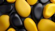 © Juan - Abstract black and yellow smooth stones arranged in a pattern
