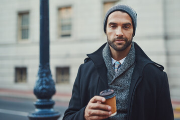 Sticker - Portrait, coffee and man in city for fashion, winter style and business travel on morning commute. Building, confident and tourist in urban town for international work, opportunity and career growth