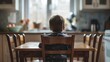 © Vlad - Social Problems: Lonely Child at Empty Dining Table in Kitchen. Back View