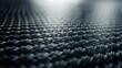 © Sirichat. Camphol - Carbon fiber texture background with good lighting. Carbon fiber composite raw material background.