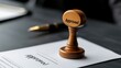 © Sittipol  - A rubber stamp with 'Approved' inked and ready to use on a contract.