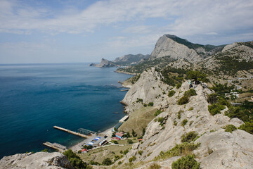 The landscape of the rocky coast of the Crimean Peninsula. Sea, sky and mountains