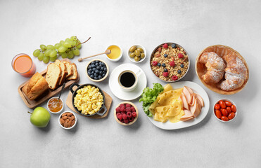 Wall Mural - Tasty breakfast. Flat lay composition with many different food and drinks on grey textured table