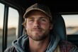 © Milos - A close-up shot of a young man slightly smiling while wearing a camouflage hat, captured with a blurry outdoor background, symbolizing a sense of calm and happiness.