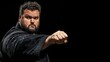 © happysunstock - Strong plus-size man mastering self-defense martial arts on black background with copy space on the left for fitness and empowerment concepts., Generative AI