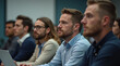© Andrew505 - Attentive Audience: Diverse Group of Businessmen Listening Intently at Professional Conference