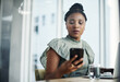 © peopleimages.com - Black woman, laptop and phone for planning in office, online research and digital notes for tasks. Female person, receptionist and email to schedule agenda, calendar app and reminder tol client