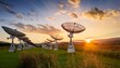© Enrique - Satellite Dishes in a Field at Sunset