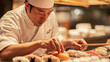© Chatchanan - A chef preparing sushi with meticulous care, highlighting the precision and dedication to tradition.