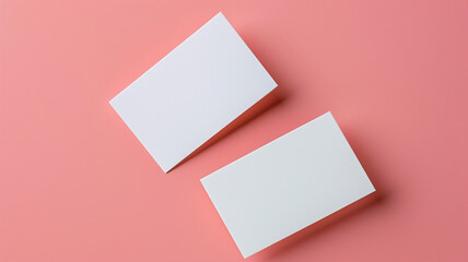 Wall Mural - white business cards on a pink background