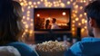 © Nathaphat - Cozy Movie Night Romance - Couple Watching Romantic Comedy on Smart TV with Popcorn in Living Room Setting
