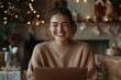 © Milos - A joyous woman works on her laptop, embraced by the warmth of holiday decorations and lights in a cozy setting, expressing contentment and festive happiness.