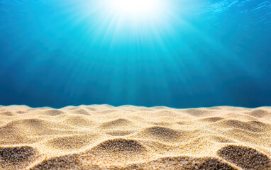 Wall Mural - Underwater view of sunlight piercing through clear ocean water, illuminating the sandy sea floor. Serene and bright marine background.