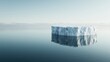 © Dulemegapixel - An isolated iceberg floating serenely on calm blue water, representing the vastness and tranquility of nature, with clear reflections enhancing the purity of the scene.