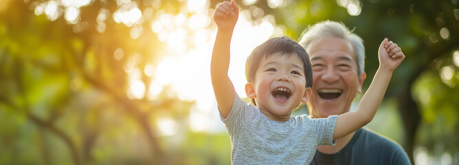 asian grandson playing and laughing together with grandfather. happy asian family children having fu