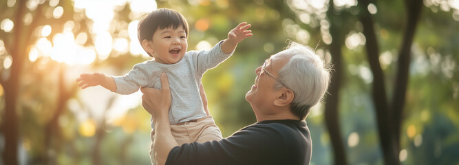 Asian grandson playing and laughing together with grandfather. Happy Asian family children having fun and playing with grandparents