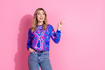 Wall Mural - Portrait photo of blonde curly hair lady wearing bright stylish sweatshirt direct finger interesting info isolated on pink color background