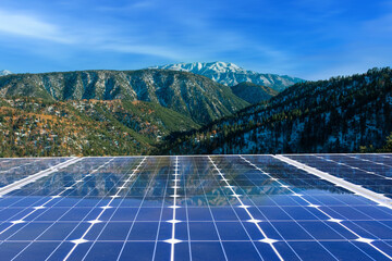 Wall Mural - Solar panels with mountains  landscape at sunset. Green energy concept.