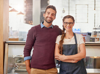 Poster - Happy business people, portrait and cafe with confidence for startup together at indoor restaurant. Creative man, woman and waitress with smile, apron or arms crossed for professional coffee shop