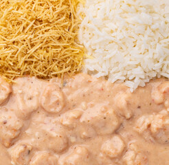 Wall Mural - Closeup of shrimp strogonoff with rice and straw potato