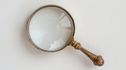 Vintage magnifying glass on white background