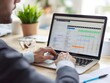 © Chumporn - Businessman Using Digital Calendar on Laptop to Organize Schedules and Appointments