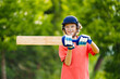 © famveldman - Kids playing cricket in summer park