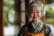 © syhin_stas - Elderly happy japanese woman wearing a kimono smiling during a keiro no hi, or respect for the aged day. 敬老の日