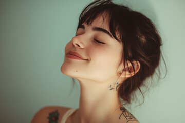 A close up of a woman's face with tattoos and her eyes closed