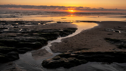 Sand patterns on beach at sunset sunrise