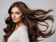 © Basileus - Woman with Long Brown Hair Flowing in the Wind