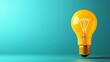 © tanayoch - A vibrant yellow light bulb glowing against a teal background, symbolizing bright ideas and creativity.