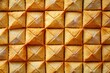 © MUdaylah - A lot of small cookies are square shaped. A pattern of a yellow salt cracker. Background image with salted pastry with generative ai