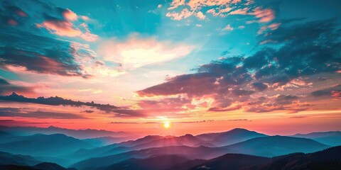 Canvas Print - Majestic sunset over cloudy mountain peaks