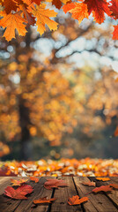 Poster - wooden table with orange leaves and blurred autumn background