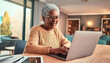 © living - An elderly woman operating a laptop. Image material of an elderly mature woman operating a laptop.