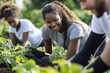 © pumungkus - Image of a group of volunteers working together on a community garden project. Show diverse individuals planting and tending to the garden, with a focus on teamwork and community spirit.
