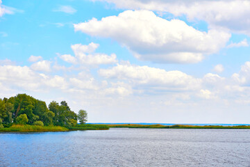 Calm quiet place for fishing on a wide summer river