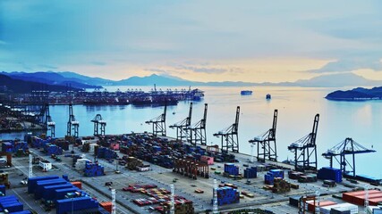 Wall Mural - Time lapse of containers in a harbor at sunrise