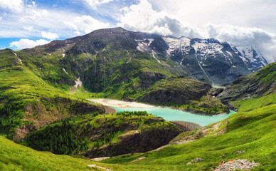 Sticker - Idyllic landscape in the Austria Alps with fresh green meadows and blooming flowers and snowcapped mountain tops in the background, Hohe Tauren - Grossglockner High Alpine Road