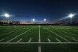 © Fotograf - A football field illuminated by night lights, ready for a game or practice