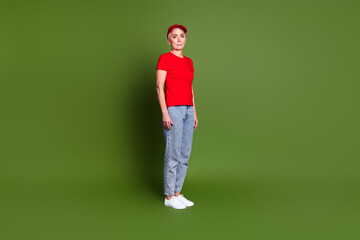 Canvas Print - Full length photo of lovely pensioner lady delivery service employee stand dressed red uniform workwear isolated on khaki color background