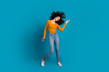 Sticker - Full body photo of attractive young woman dance discotheque dressed stylish yellow clothes isolated on blue color background