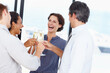 © STEEXBuyout/peopleimages.com - Business, people and cheers with champagne glasses in office for success, celebration and achievement. Employees, partners and excited or happy with alcohol for teamwork, collaboration and toast
