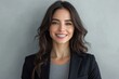 © Surachetsh - Businesswoman in her 30s poses in a formal outfit, exuding confidence against a crisp white office backdrop.