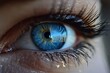© Betti - Close-Up of a Blue Eye with Detailed Reflection
